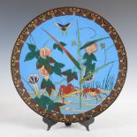 A Japanese blue ground cloisonne charger, Meiji Period, decorated with two crabs, flowers, foliage