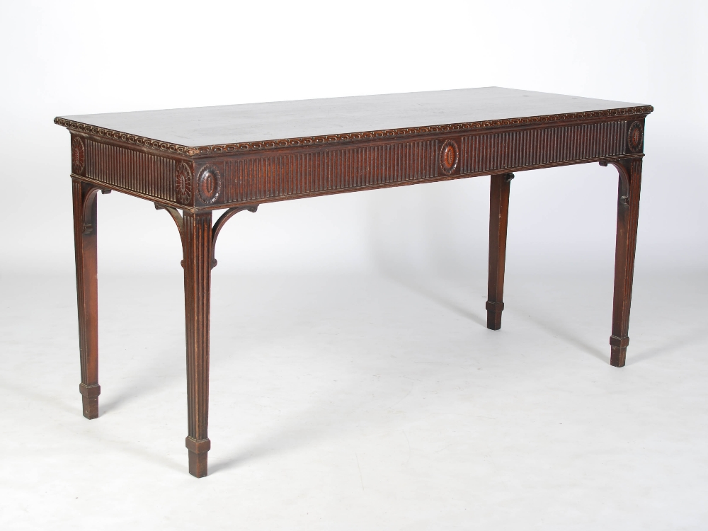 An early 20th century George III style mahogany serving table, the rectangular top with an oval