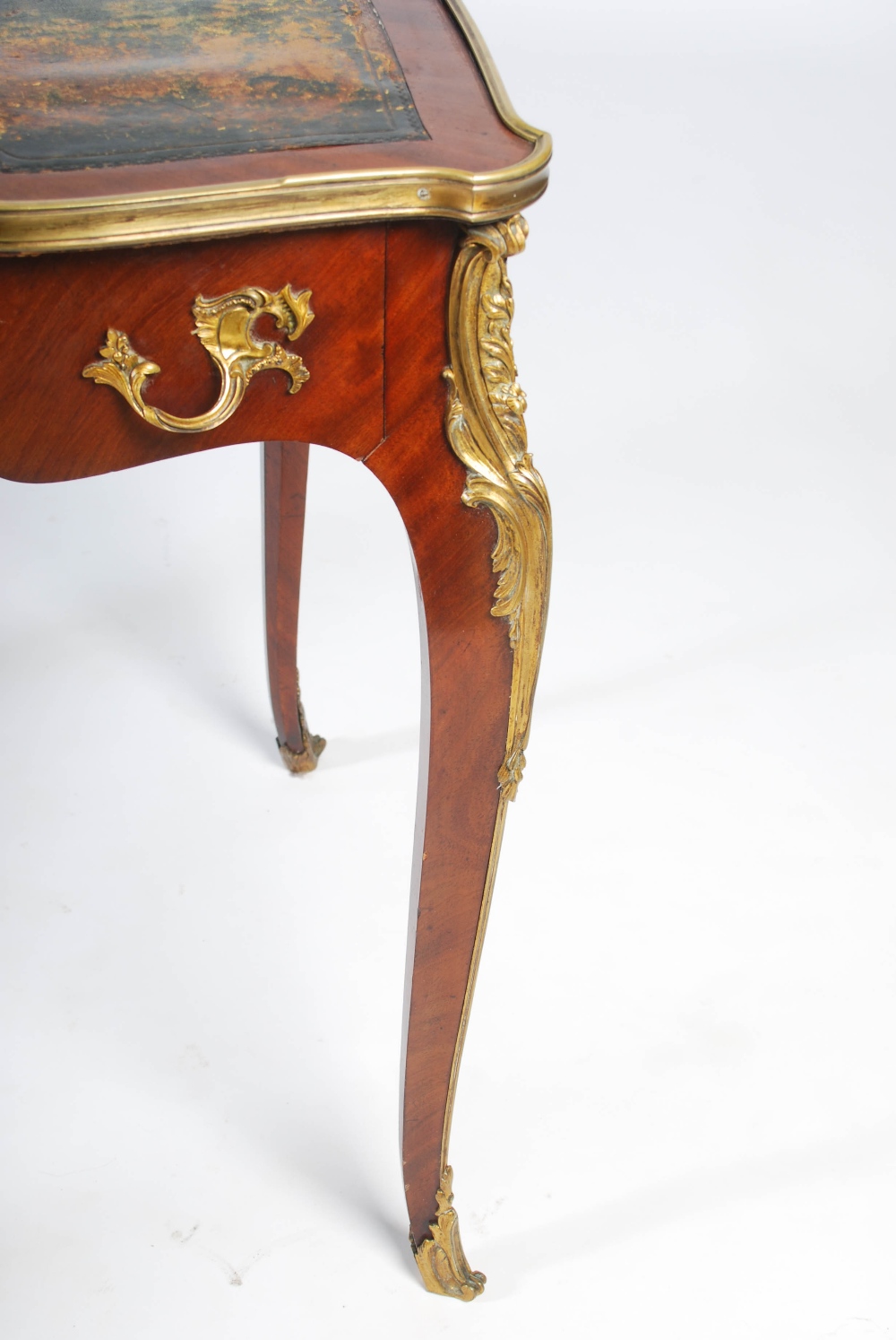 A late 19th/early 20th century mahogany and gilt metal mounted writing table in the Louis XV style - Image 5 of 6