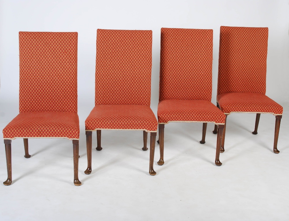 A set of ten early 20th century mahogany dining chairs, the needlework backs and seats raised on