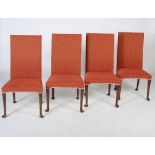 A set of ten early 20th century mahogany dining chairs, the needlework backs and seats raised on