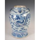 A Chinese porcelain blue and white jar, Qing Dynasty, decorated with a pair of dragons contesting