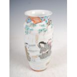 A Japanese porcelain vase, early 20th century, decorated with two females and attendant boy in a