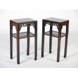 A pair of Chinese dark wood jardiniere stands, Qing Dynasty, the rectangular panelled tops above