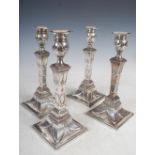 A set of four George III silver candlesticks, Sheffield, 1777, makers mark of DH, with detachable