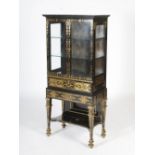 A 19th century ebony and brass inlaid display cabinet on stand, the rectangular top with a moulded