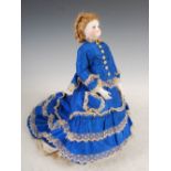 A 19th century bisque head doll, with mohair wig and inlaid glass eyes, with bisque forearms and