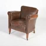 An early 20th century mahogany and brown leather upholstered armchair, raised on tapered square