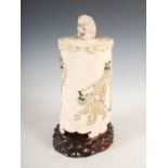 A Japanese ivory tusk vase and cover, Meiji Period, the vase carved in relief with a full elephant