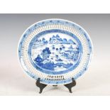 A Chinese porcelain blue and white oval shaped dish, Qing Dynasty, decorated with sampans and
