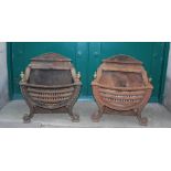 A pair of Neo Classical style fire baskets, with brass urn finials, raised on scroll supports and