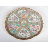 A Chinese porcelain famille rose Canton tray, Qing Dynasty, decorated with panels of figures and