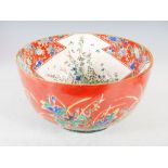 A large Japanese Ao Kutani pottery bowl, Meiji Period, the interior decorated with shaped panels