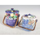 Two Bough Pottery biscuit barrels and covers, the larger purple ground biscuit barrel decorated with