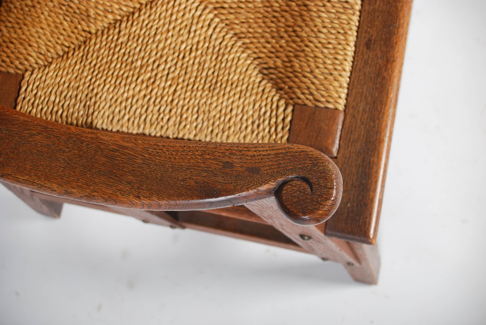 A late 19th/early 20th century oak Orkney chair, with woven back and woven drop in seat, raised on - Image 6 of 6