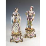 A pair of late 19th century Paris porcelain figure groups, modelled as male and female court