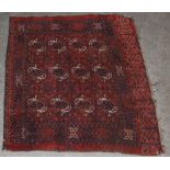 A Tekke rug, early 20th century, the madder ground decorated with twelve octagonal shaped guls