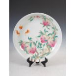 A Chinese porcelain dish, bearing Yongzheng mark but later, decorated with eight peaches and bats,