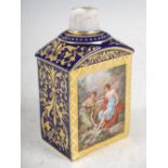 A Vienna porcelain cobalt blue ground tea caddy, decorated with rectangular panels of figures