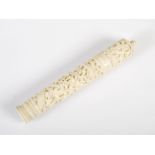 A Chinese ivory needle case, Qing Dynasty, of tapered cylindrical form carved with a dragon, birds