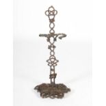 A late 19th century bronze stick stand, formed from simulated entwined ivy, on a dished and