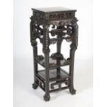 A rare Chinese dark wood jardiniere stand, Qing Dynasty, the square shaped top with a mottled red