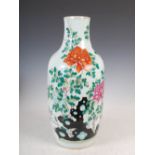A Chinese porcelain famille rose vase, Qing Dynasty, decorated with rockwork and peony, 54cm high.