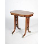 A 19th century Regency style rosewood and brass inlaid work table, the shaped rectangular top with a