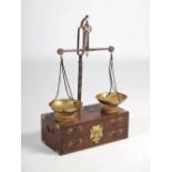 A set of Chinese dark wood and brass mounted balance scales, late 19th/ early 20th century, with