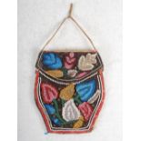 A late 19th/ early 20th century American Indian bead work woman's pouch, decorated on both sides