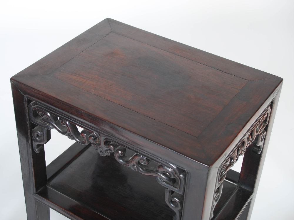 A pair of Chinese dark wood jardiniere stands, Qing Dynasty, the rectangular panelled tops above - Image 2 of 4