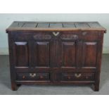 An oak mule chest, the frieze carved with initials 'ID' and date 1775, with hinged cover and two