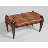 A mid 20th century rosewood rectangular stool, with button down brown leather upholstered cushion,