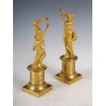 A pair of 19th century ormolu Classical maidens, modelled dancing, raised on cylindrical socles