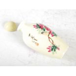 A Chinese porcelain yellow ground snuff bottle, decorated with birds perching on flowering branches,