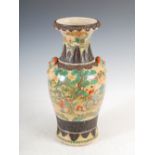 A Chinese porcelain crackle glazed famille verte vase, Qing Dynasty, decorated with a continuous