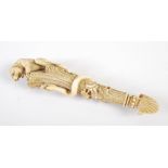 A 19th century European ivory fan handle, carved in the form of a branch with lion and serpent, 16cm