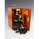 A Carl Zeiss Jena microscope, Nr. 61650, in fitted mahogany case with assorted accessories.