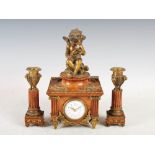 A late 19th/early 20th century burr walnut and ormolu mounted clock garniture, the clock with a