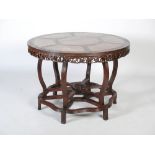 A Chinese dark wood and mother of pearl inlaid centre table, Qing Dynasty, the circular top