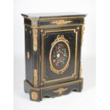 A 19th century French ebonised, gilt metal mounted and pietra dura side cabinet, the shaped