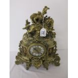 Ornate brass mantle clock with horse and rider