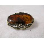 Amber set silver brooch