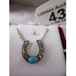 Silver & stone set horseshoe pendant on chain