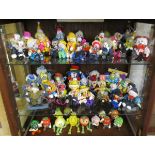 Large collection of clowns etc (3 shelves)