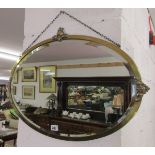 Brass framed and bevelled glass oval mirror