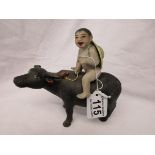 Interesting ceramic boy on buffalo figurine