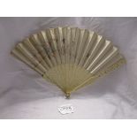 Old Oriental fan with ivory faces