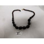 String of vintage dark amber beads