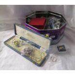 Tin of costume jewellery